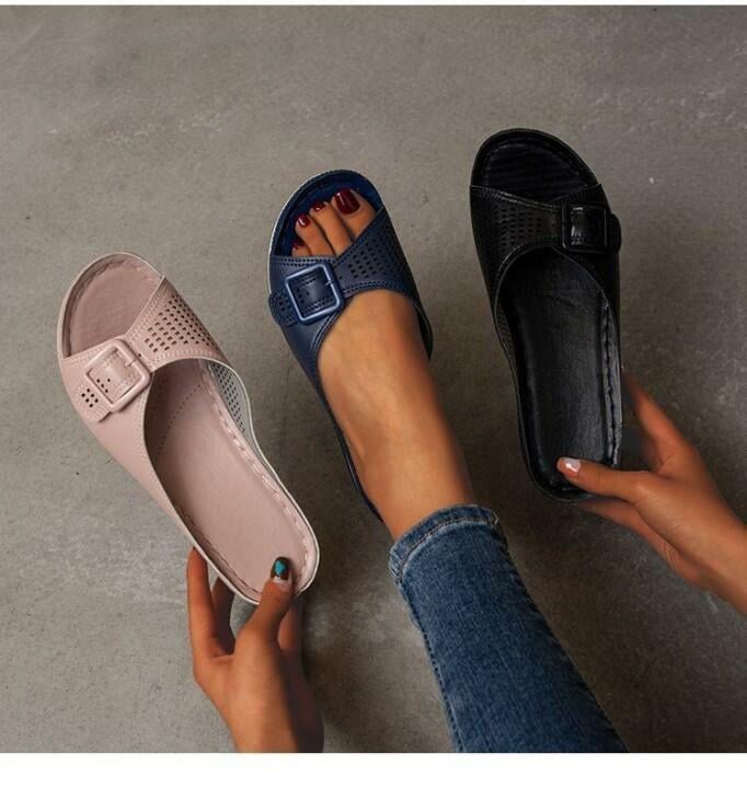 Babette orthopedic flat sandal in black styled with linen trousers on a model