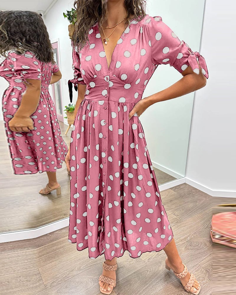 Side view of polka dot midi dress showing relaxed silhouette and sleeve length