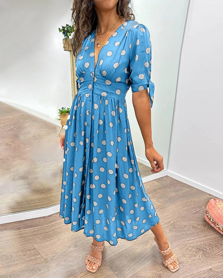Close-up of sleeve and shoulder detail on the elegant polka dot dress
