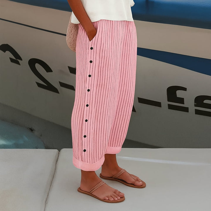 Women's comfortable pants available in blue, black, gray, and pink shown in a lifestyle setting