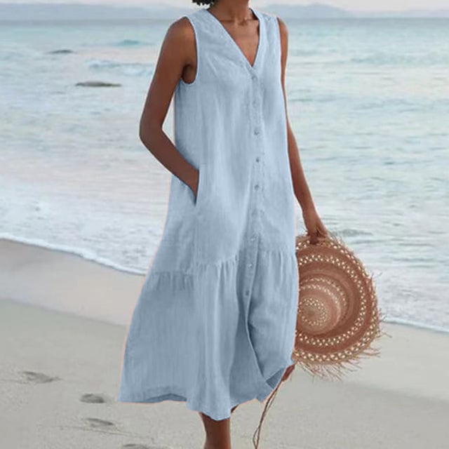 Model wearing sleeveless midi dress in blue showing full-length silhouette and front button placket