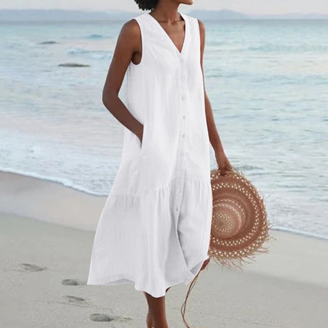 Close-up of front button detail on sleeveless midi dress in white