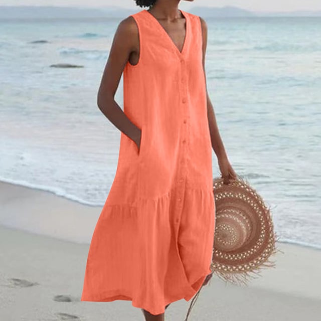 Sleeveless midi dress in orange styled casually for a summer day