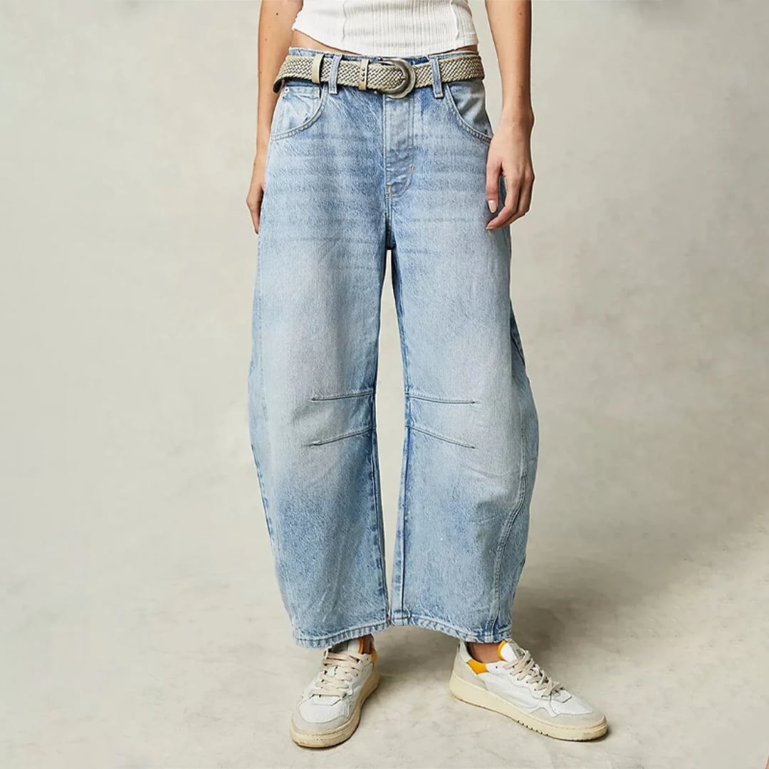 Front view of women's high waist barrel leg jeans in light blue acid wash