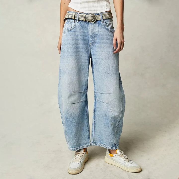 Front view of women's high waist barrel leg jeans in light blue acid wash