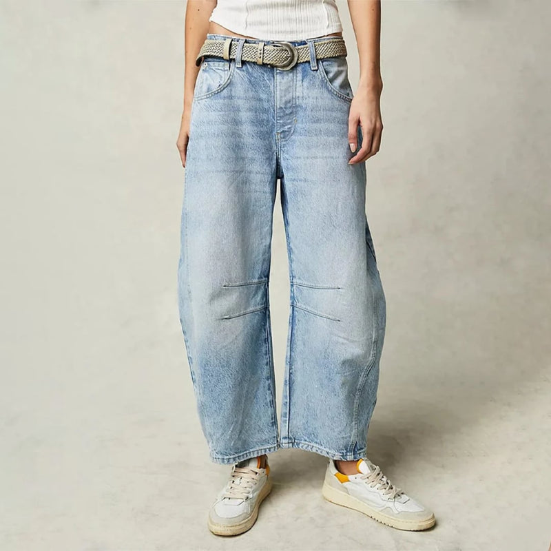 Front view of women's high waist barrel leg jeans in light blue acid wash