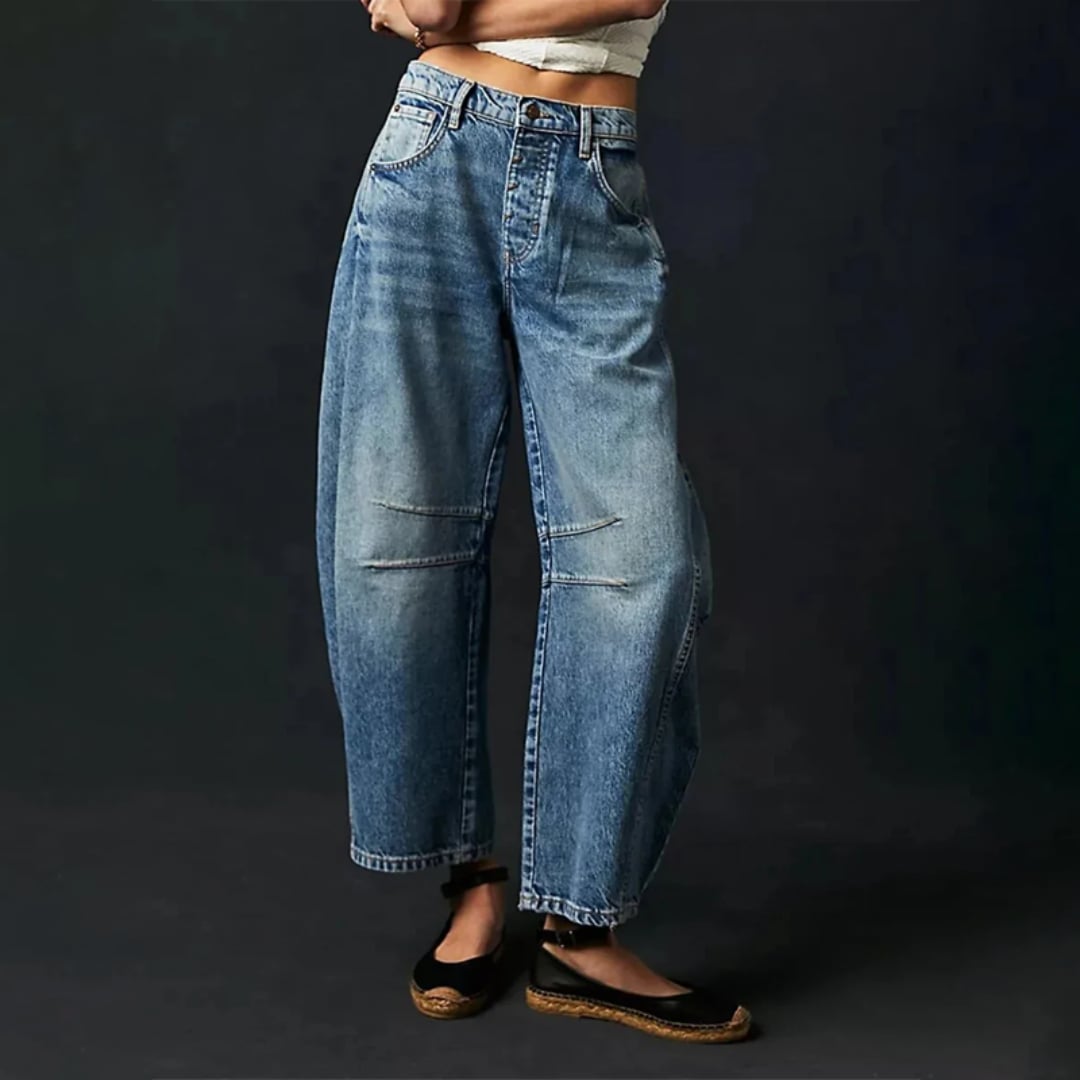 Side view of barrel leg jeans highlighting the rounded sculptural silhouette