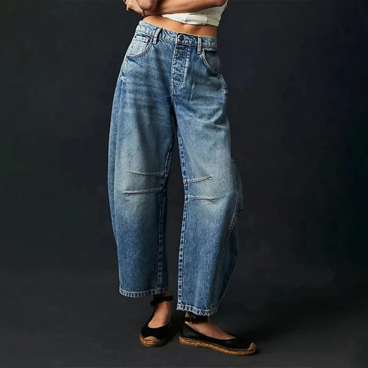 Side view of barrel leg jeans highlighting the rounded sculptural silhouette