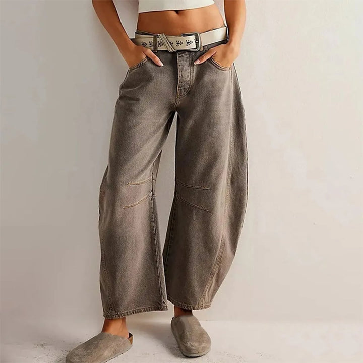 Back view of high rise barrel leg jeans in light blue showing 5-pocket design