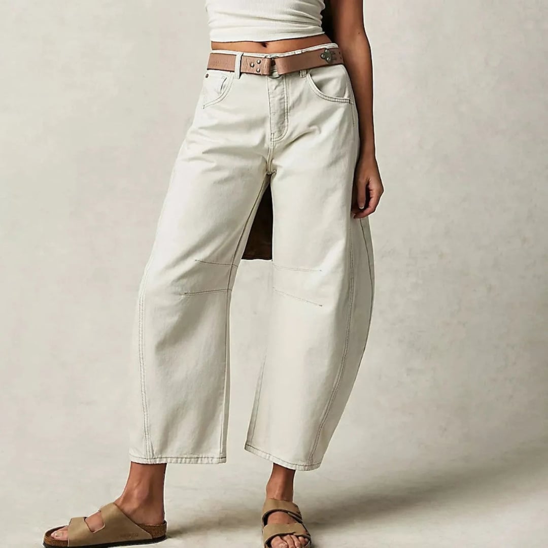 Back view of dark blue relaxed fit barrel leg jeans