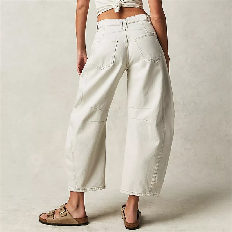 Front view of women's barrel leg jeans in dark gray