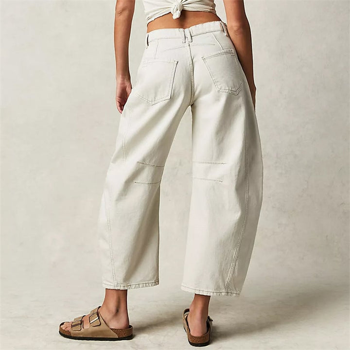 Front view of women's barrel leg jeans in dark gray