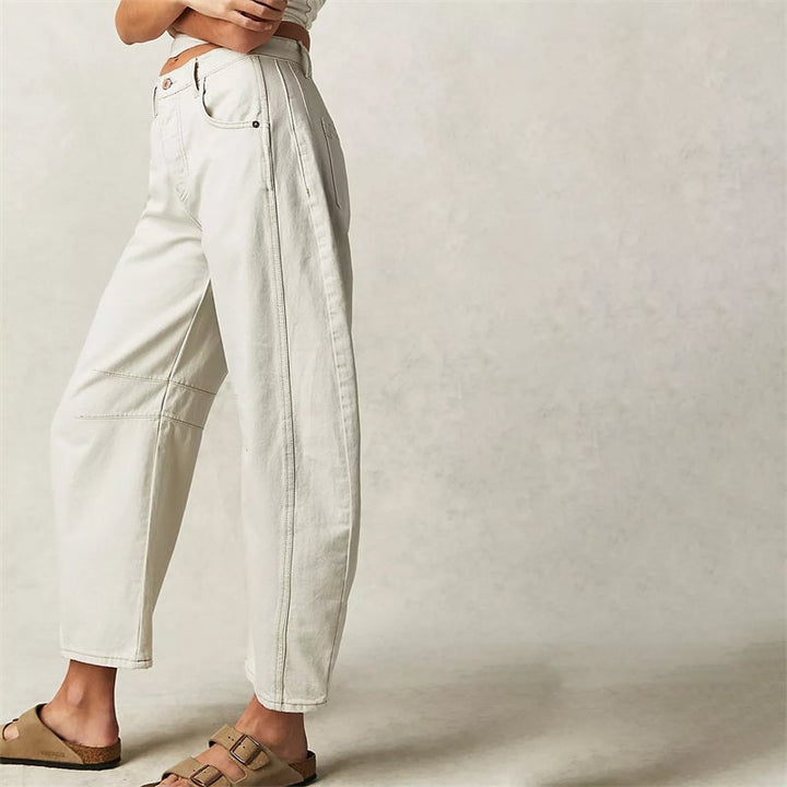Side view of dark gray high waist barrel leg relaxed fit jeans