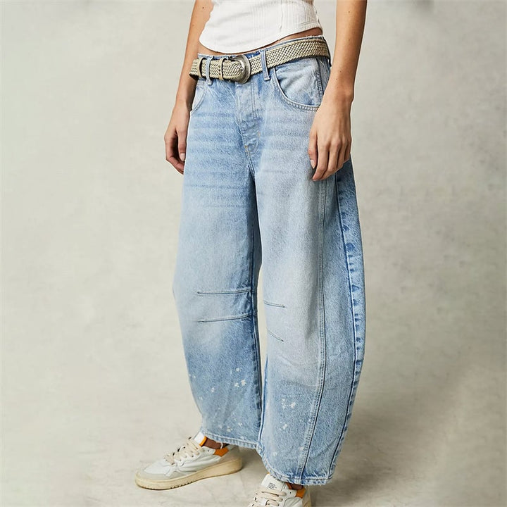 Side view of black barrel leg jeans showing exaggerated barrel shape