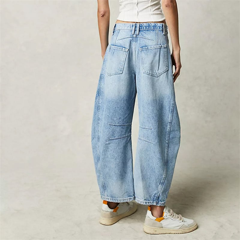 Back view of black relaxed fit barrel leg jeans