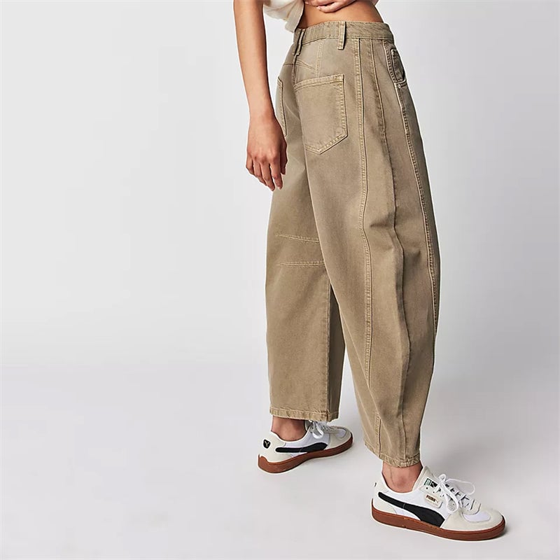 Side profile of white high waist barrel leg jeans