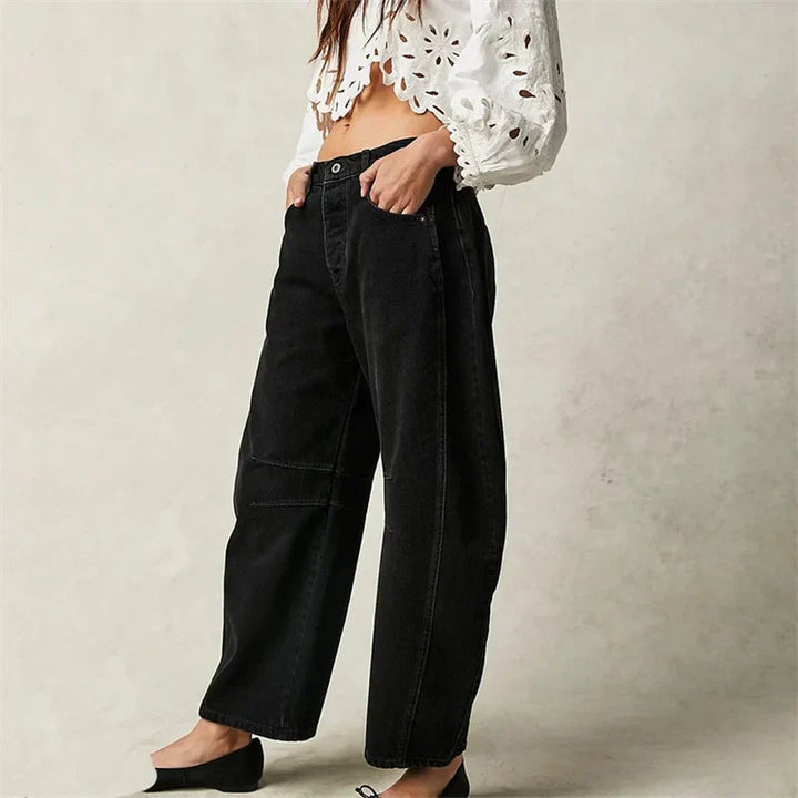 Front view of barrel leg jeans in beige denim