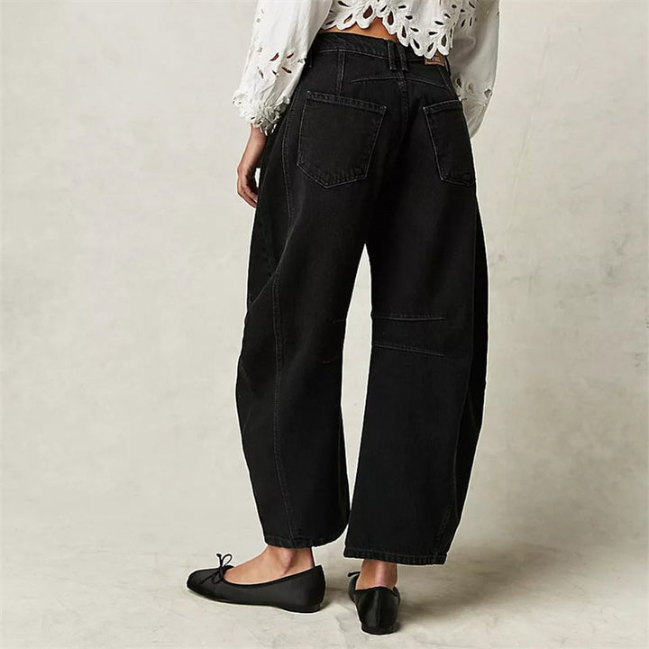 Back view of beige relaxed fit barrel leg jeans