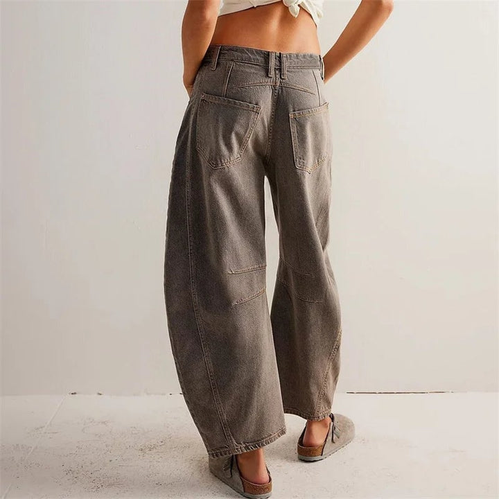 Overhead flat lay of barrel leg jeans in all six available colors