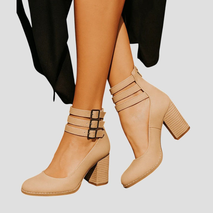Overhead flat-lay of multiple boot color options including black, white, and red
