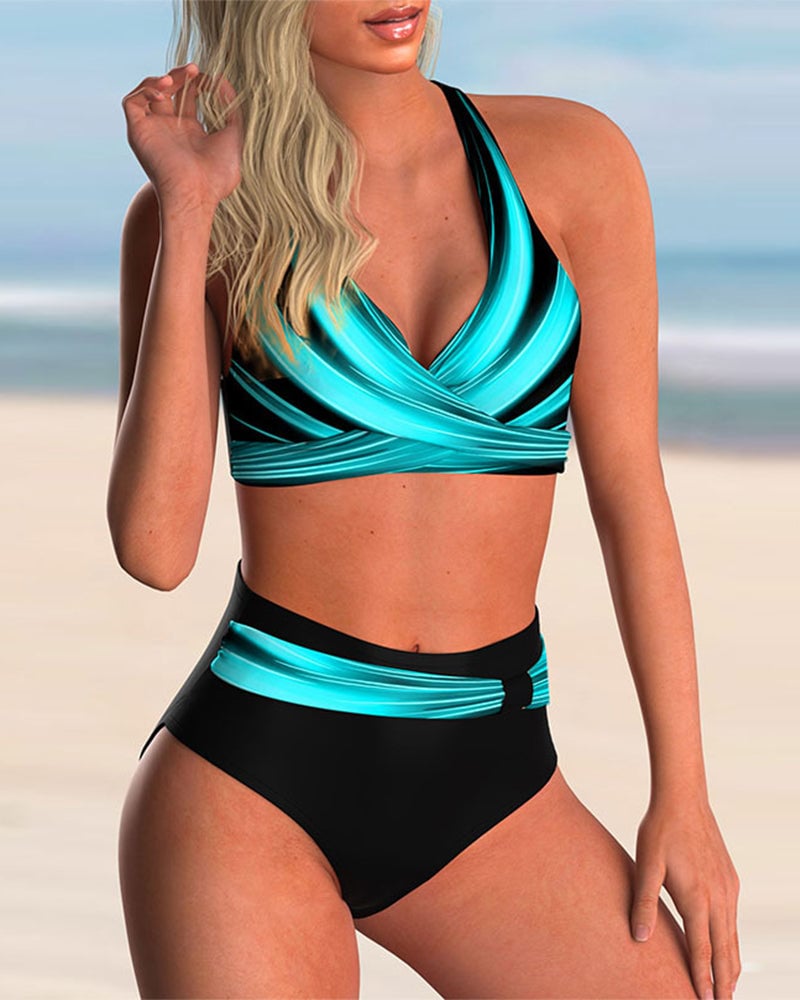 Close-up of the Beatrice bikini set showing the artful blue and black print detail and cross neckline construction