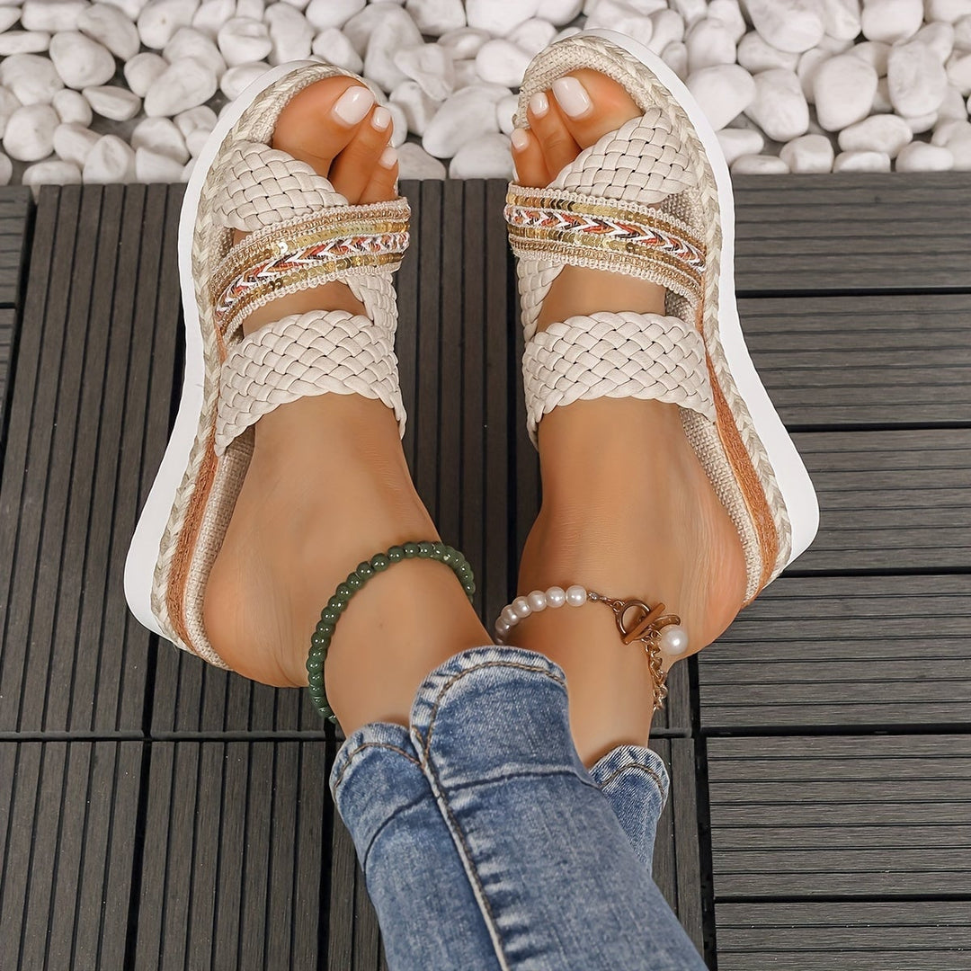 Side view of Beatrice woven slip-on sandals in ivory white highlighting braided strap detail
