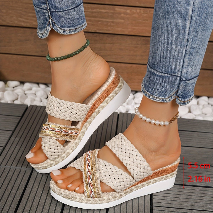 Beatrice beige woven sandals styled with a linen outfit in a casual outdoor setting