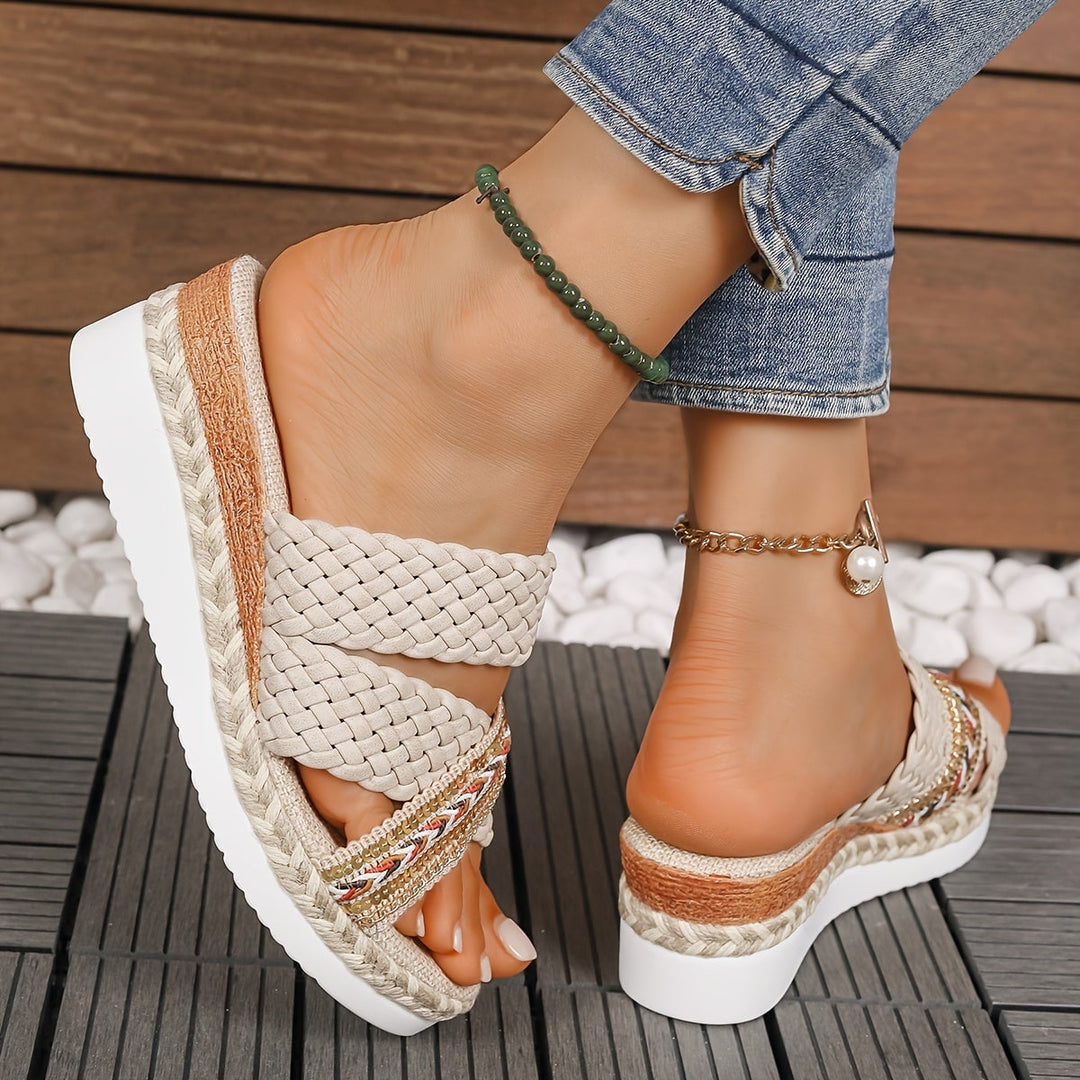 Heel and sole view of Beatrice woven slip-on sandals in beige showing flexible construction