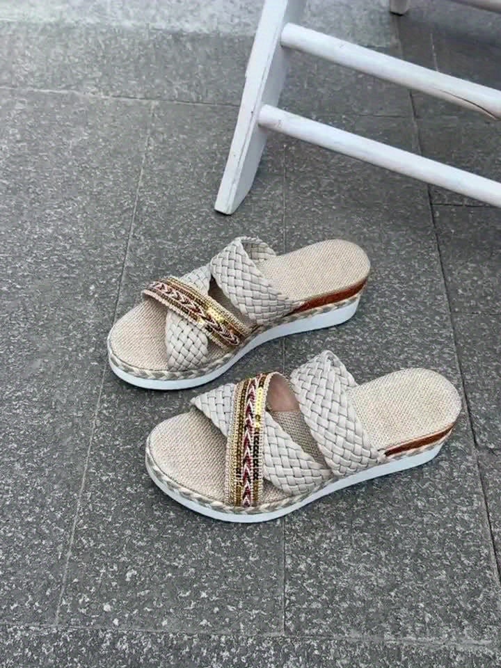 Flat lay of both Beatrice sandal colorways — ivory white and beige — side by side