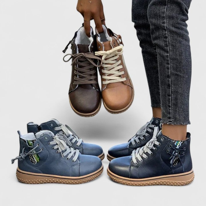 Beatrice lace-up ankle boots in blue with side zipper detail, angled view