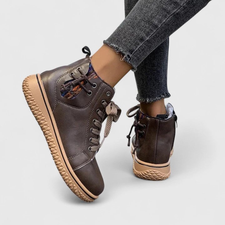 Close-up of block heel on Beatrice ankle boots showing sole construction