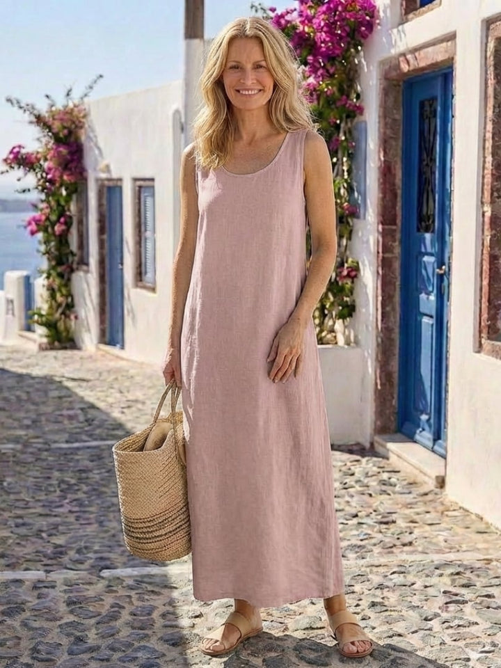 Front view of a pink sleeveless round neck maxi dress with a loose, flowing silhouette