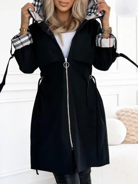 Model wearing the windproof zip coat in black, full-length side profile showing tailored silhouette