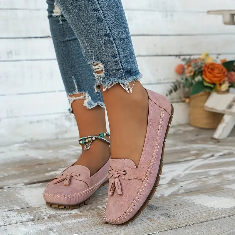 Pink comfort loafers with flexible sole shown at a slight angle