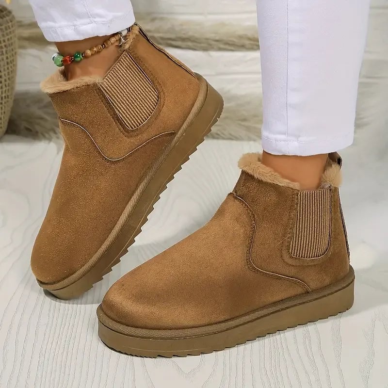 Solid color short ankle boots shown in a clean studio setting highlighting the streamlined silhouette