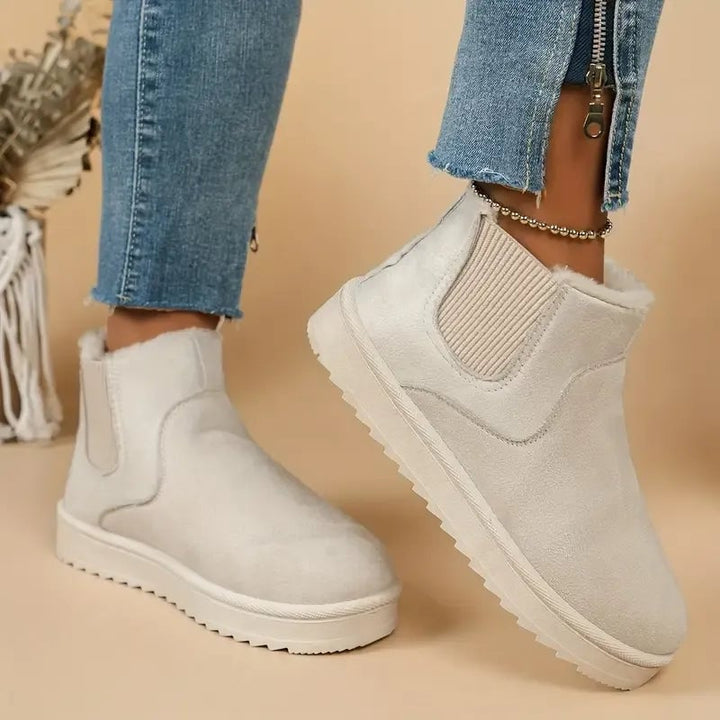 Solid color short boots styled with a casual outfit to show everyday versatility