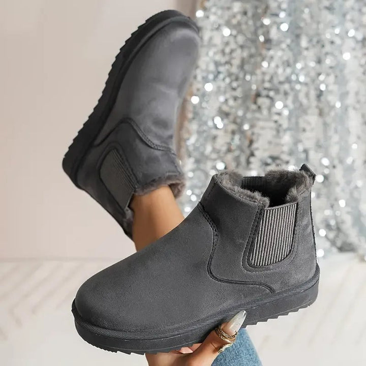Multiple color options of the solid color short boots including khaki, black, brown, white, pink, and gray