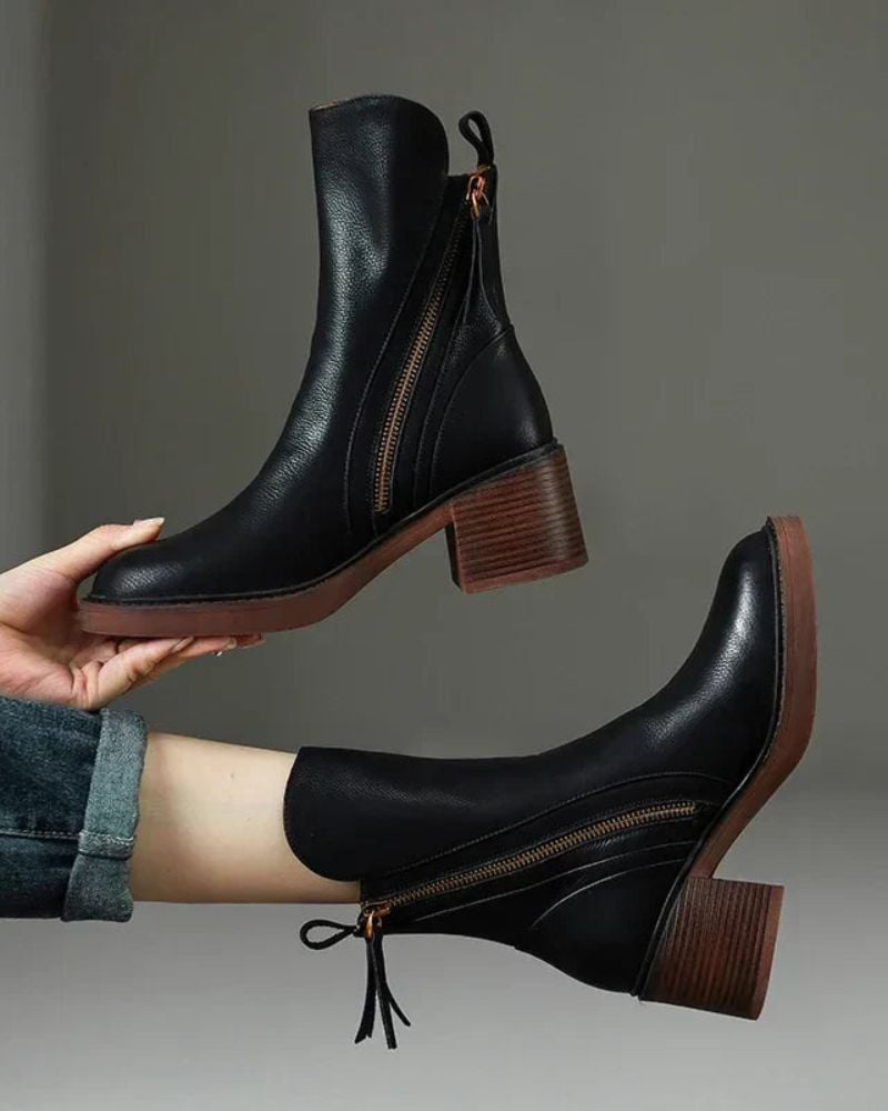Front view of Belinda elegant ankle boots in black with cushioned interior and polished finish