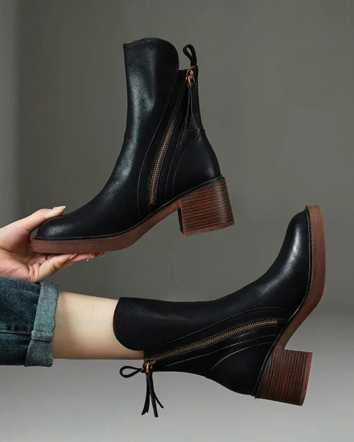 Front view of Belinda elegant ankle boots in black with cushioned interior and polished finish