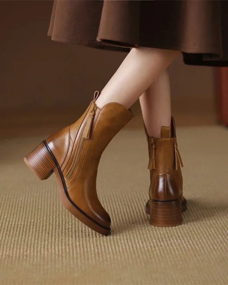 Overhead flat-lay of Belinda elegant ankle boots in both black and brown colorways