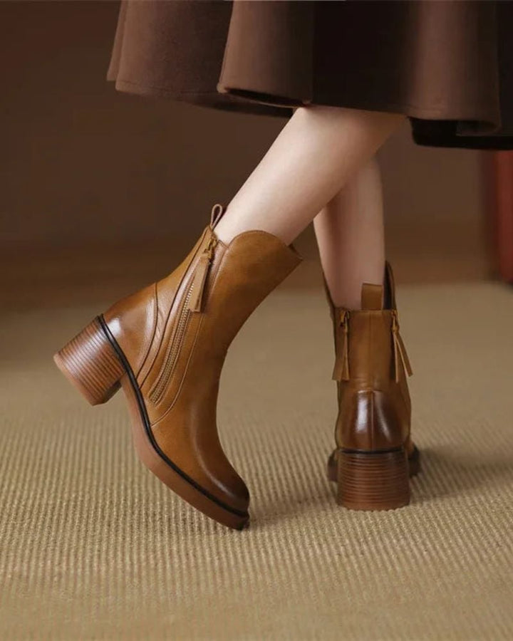 Overhead flat-lay of Belinda elegant ankle boots in both black and brown colorways