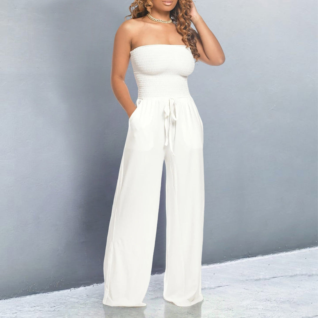 Close-up of the elastic off-shoulder neckline and drawstring waist detail on a wide-leg jumpsuit in pink