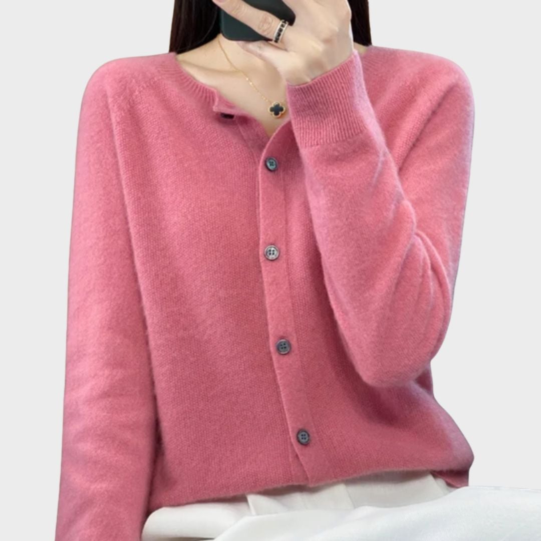 Model wearing Bella cardigan in pink with jeans, demonstrating effortless casual styling