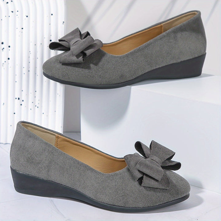 Brown bow accent round toe ballet flat, front view
