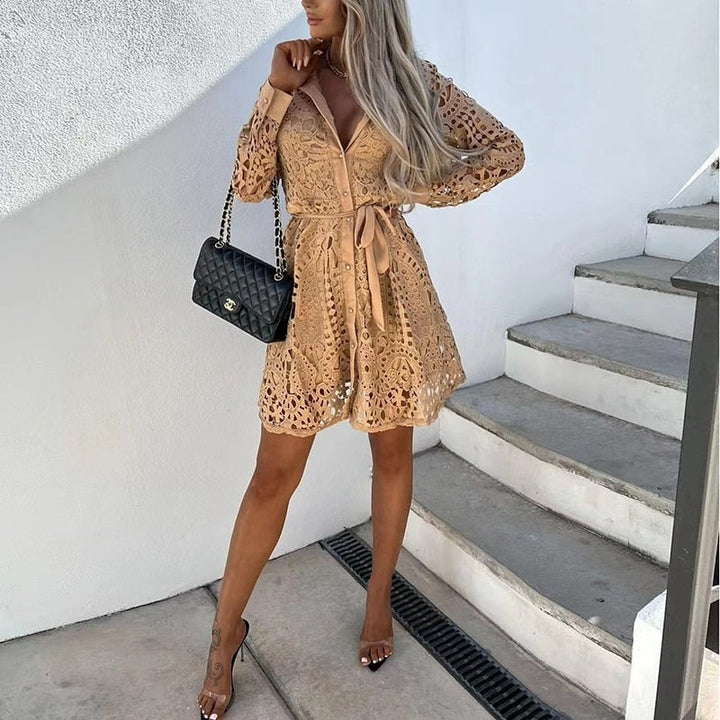 Side view of the Bella gold lace mini dress highlighting the flared skirt and puff sleeve detail