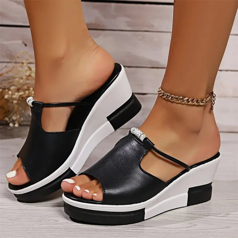 Belle women's orthopedic cushioned wedge sandal in black, side profile view showing contoured footbed and wedge heel