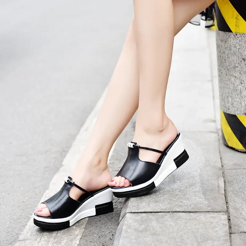 Top-down view of Belle cushioned wedge sandal in black showing strap detail and contoured footbed