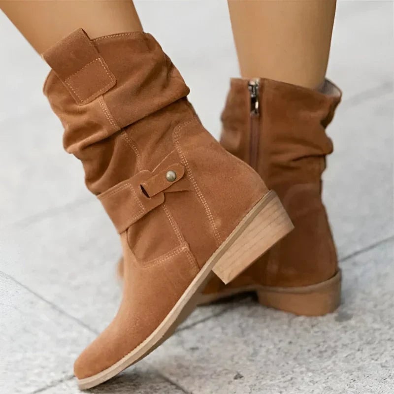 Side profile of Berdine soft-sole boots highlighting the sleek contoured silhouette in brown