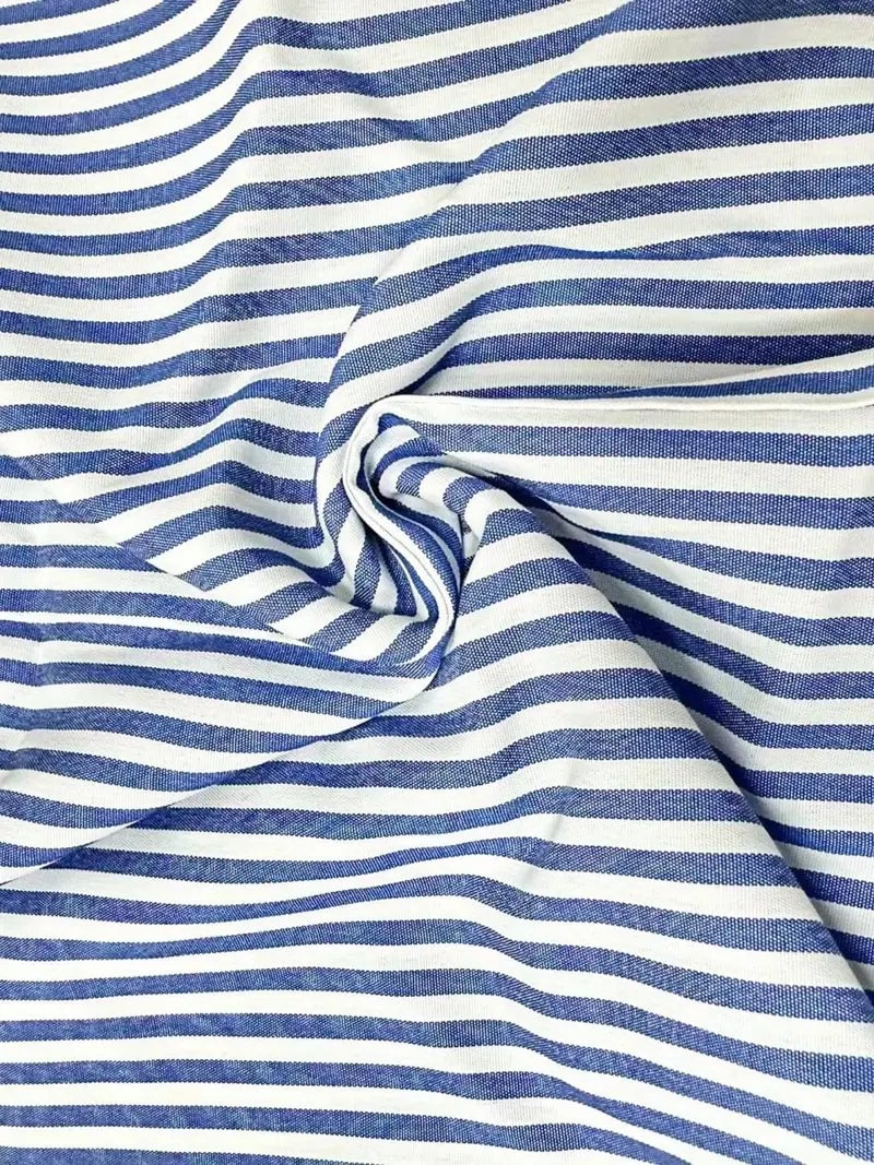 Full-length view of the striped summer dress styled for an evening look with heels