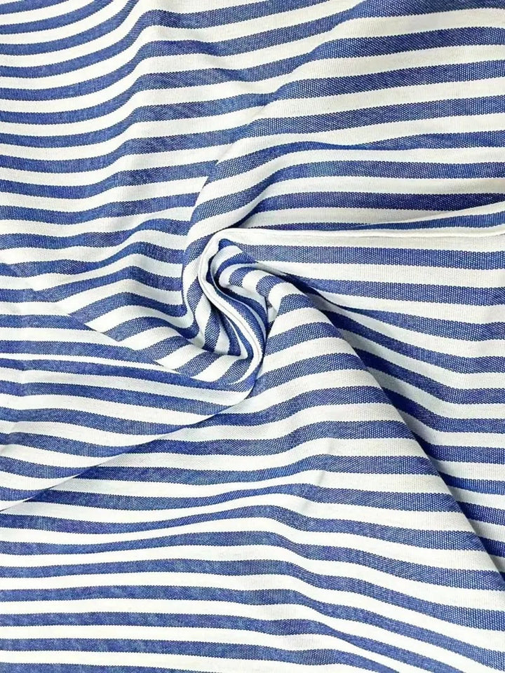 Full-length view of the striped summer dress styled for an evening look with heels